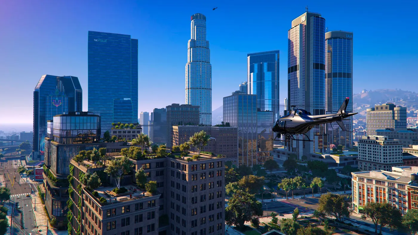 Vue aérienne du centre-ville de Los Santos repensé pour NoPixel V, gratte-ciels vitrés dont une tour portant l'enseigne The Pixel, toits végétalisés, hélicoptère noir en vol sous un ciel bleu clair