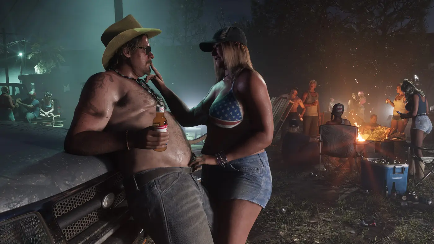Une fête nocturne autour d'un feu de camp dans l'arrière-pays de Leonida : un homme torse nu en chapeau de cowboy, une femme en haut aux couleurs du drapeau américain et une foule de fêtards près du brasier dans GTA VI